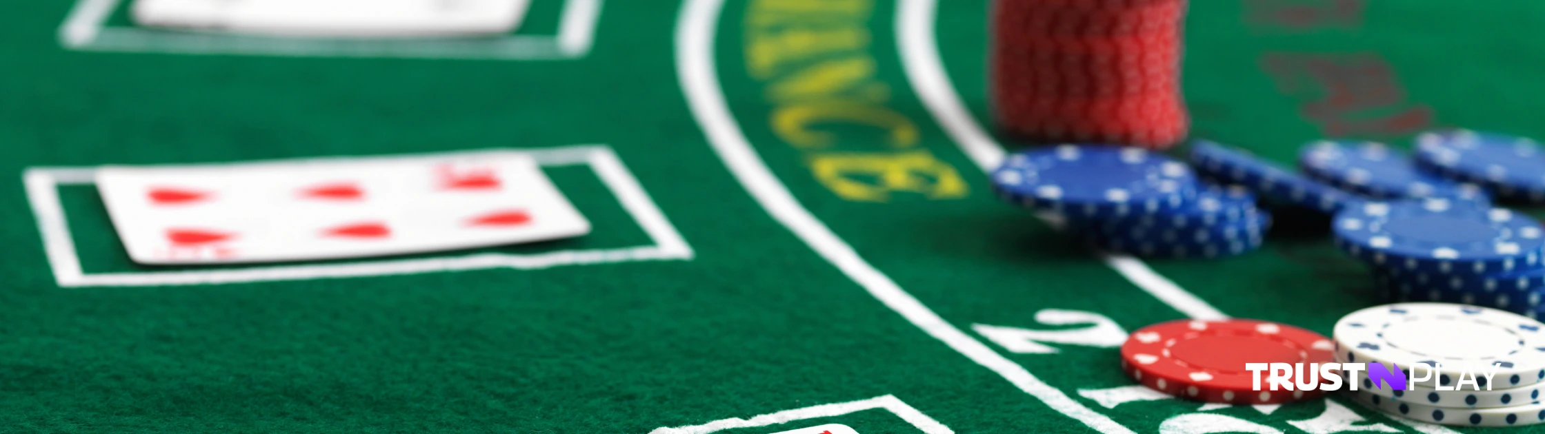 Cards and chips at a blackjack table.