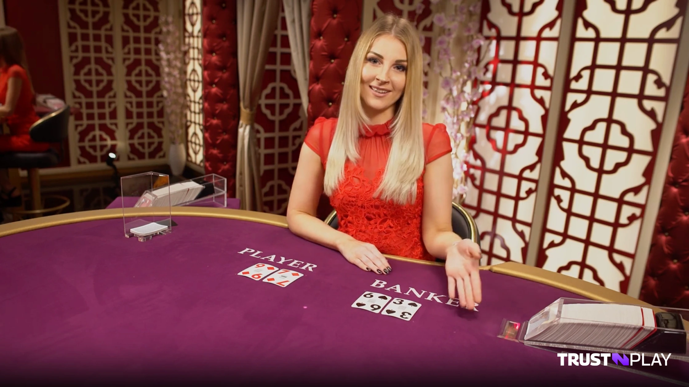 Live dealer at No Commission Baccarat game by Evolution.